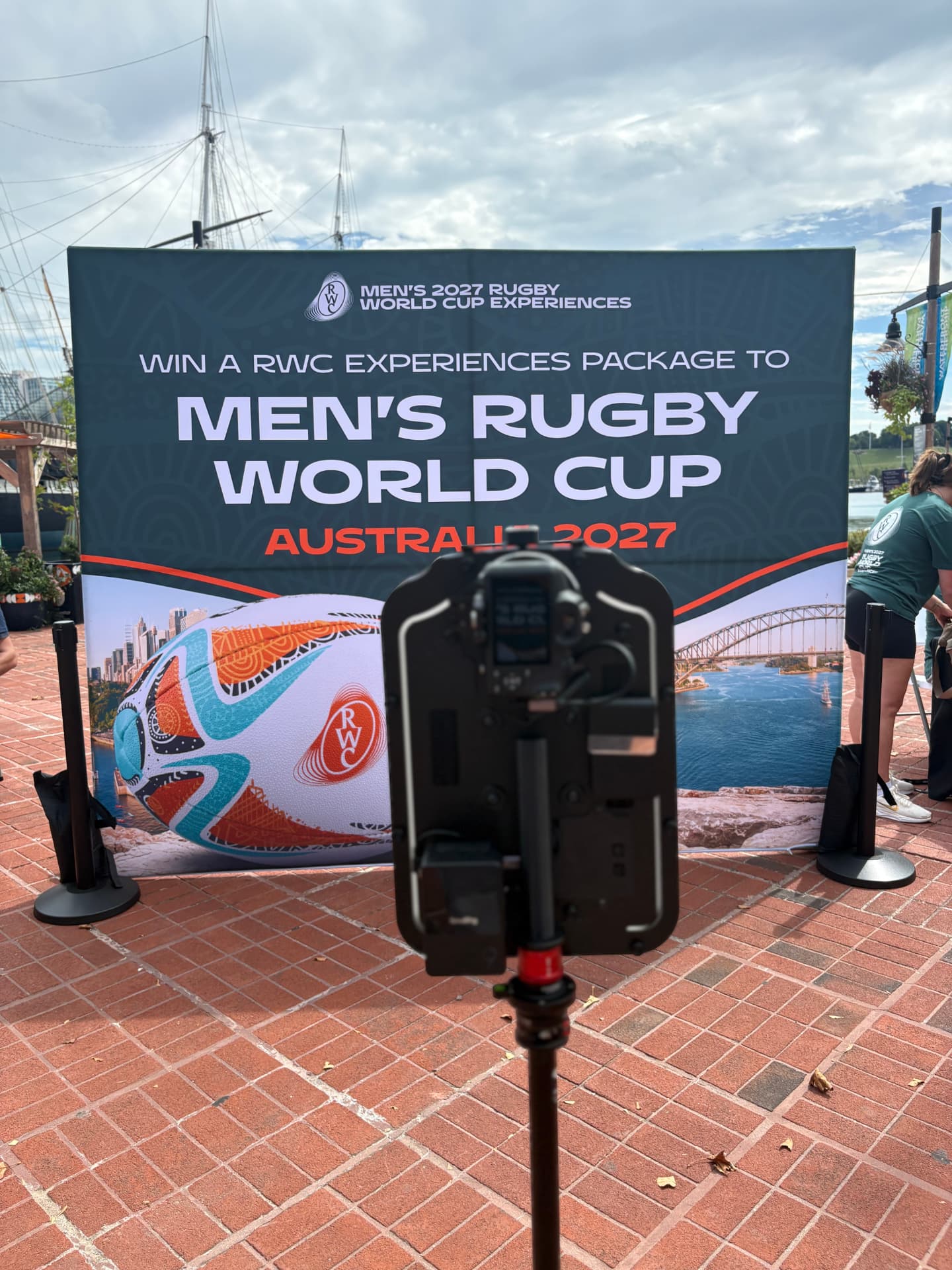 Photo booth facing the Rugby World Cup Experiences backdrop at the Inner Harbor