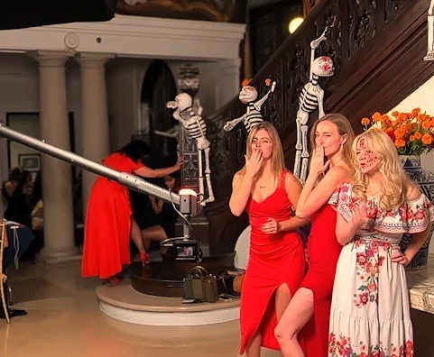 Friends posing on 360 photo booth platform