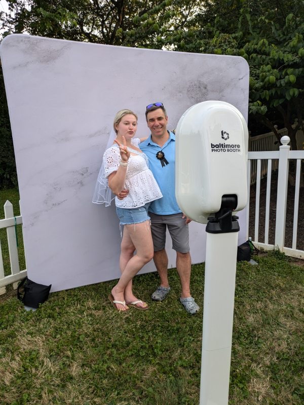 Couple at outdoor selfie booth